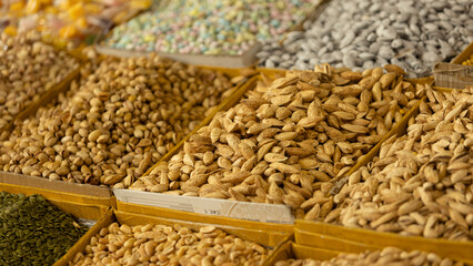 a basket of dried nut, fruit and almond in Osh Bazaar at Bishkek, Kyrgyzstan. 