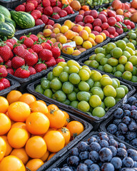 A bustling farmers&acirc;&euro;&trade; market celebrating spring&acirc;&euro;&trade;s bounty, featuring stalls brimming with vibrant