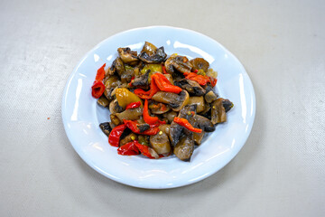 Spicy salad with mushrooms, arugula and sesame. Vegan dish. The top view
