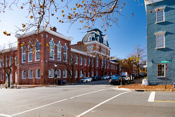 Vintage red brick townhouses in historic Alexandria, Virginia.