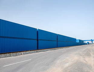 A row of blue containers with the word Hobbs on them
