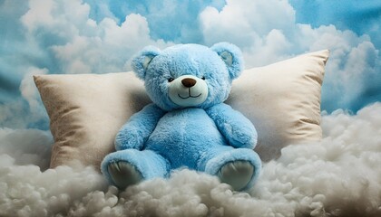Light blue teddy bear resting on a plush pillow surrounded by soft clouds