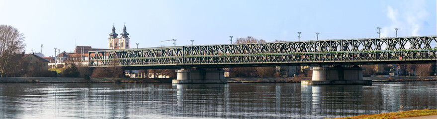 Road and railway bridges across the Danube river on a snowless winter day in the city of Tulln in Austria