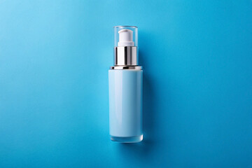 Blue lotion bottle, pump dispenser, blue background, product shot, cosmetics