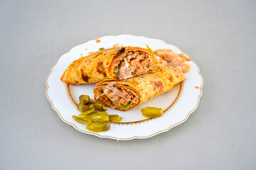 Lavash zurna doner kebab ( zurna  durum )  or shawarma sliced in plate isolated.  hatay usulu tavuk Et doner durum. Gobit ekmek arasi doner. Pilavustu iskender doner kebap. 
