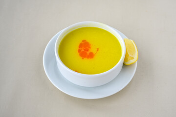 Lentil ( mercimek corbasi ) soup with melted butter and red pepper sauce. Limon ve soslu mercimek...