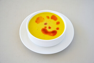 Lentil ( mercimek corbasi ) soup with melted butter and red pepper sauce. Limon ve soslu mercimek corba.
