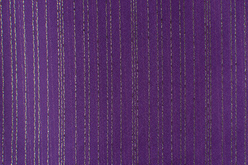 The texture of knitted fabric with lurex. A fragment of shiny striped fabric