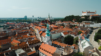 Naklejka premium Bratislava old town view castle and city church in city centre. bratislavy skyline aerial view drone footage of bratislava slovakia city.