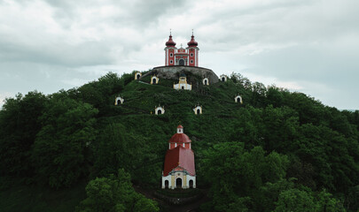Beautiful aerial shot of a late Baroque Calvary, Church on hill in Banska Stiavnica, Slovakia