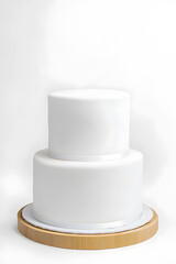 White two tier wedding cake with no decorations mock up isolated on white background