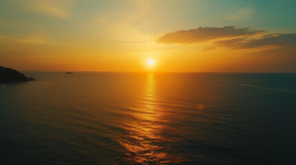 A serene sunset over the calm ocean, where golden hues reflect on the water's surface, creating a peaceful and breathtaking view that evokes feelings of tranquility and beauty.