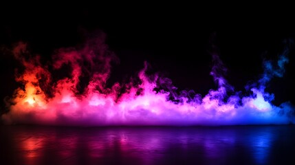 Captivating image of colorful moody mist and fog floating over a tranquil lake or pond creating a surreal dreamlike atmosphere in a mysterious nighttime landscape setting