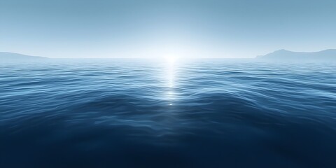 Fototapeta premium A serene view of calm ocean waters reflecting the soft glow of the sun, with gentle waves creating a tranquil atmosphere and distant hills faintly visible on the horizon.