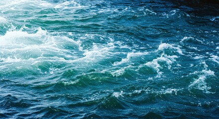 Fototapeta premium Ocean Waves Texture: A mesmerizing close-up of deep teal ocean waves, their white crests creating a dynamic texture of movement and energy.