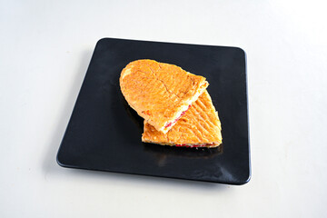 Turkish karisik atom Ayvalik tost ( kasarli bazlama tost) . Sucuklu, Kasarli, kavurmali karisik tost. Flat baked bread toasted. Karisik bazlama tost .  