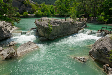 Naklejka premium Le Claps, Luc en Diois, Drôme, southern France. In 1442, limestone rockslide eroded the bed of the Drôme and formed two lakes. The chaotic pile of stone blocks still suggests the violence of disaster