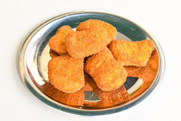 Homemade fried chicken nuggets isolated on white background. Chicken nugget. Citir tavuk. Citir, tavuk atistirma  tabagi.