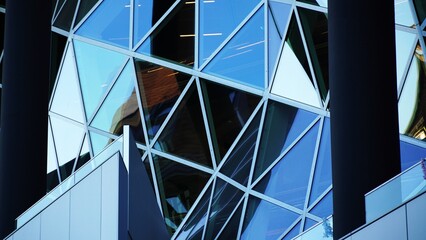 modern office building with blue triangle windows