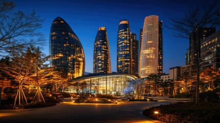 A city skyline at night with a large building in the middle
