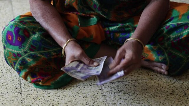 House wife counting cash money indian rupees - finance concept