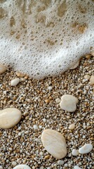 Beach waves and pebbles close-up, perfect for backgrounds