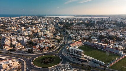 Aerial view of Larnaca, Cyprus with stadium and sea.