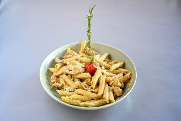 Macaroni Salad with red bell pepper, onion, celery, gherkins and mayonnaise dressing.Traditional Italian pasta with vegetables and creamy cottage cheese in a bowl. Fettuccini, alfredo makarna.