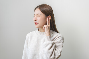 Tinnitus concept, sick asian young woman, girl have ear pain or earache, hand touch plug ear,...
