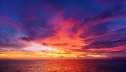 Obraz premium a vibrant sunset sky with shades of orange pink and purple blending together beautifully