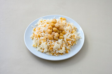 Traditional delicious Turkish food; Turkish style rice pilaf (Turkish name; Arpa sehriyeli. tavuk, kuru fasulyeli, pirinc pilavi). Cigerli, kavurmali, tereyagli nohut pilav.
