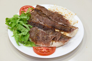 Lavash zurna doner kebab ( zurna  durum )  or shawarma sliced in plate isolated.  hatay usulu tavuk Et doner durum. Gobit ekmek arasi doner. Pilavustu iskender doner kebap. 