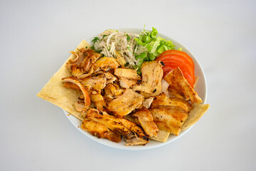 Lavash zurna doner kebab ( zurna  durum )  or shawarma sliced in plate isolated.  hatay usulu tavuk Et doner durum. Gobit ekmek arasi doner. Pilavustu iskender doner kebap. 