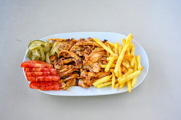 Lavash zurna doner kebab ( zurna  durum )  or shawarma sliced in plate isolated.  hatay usulu tavuk Et doner durum. Gobit ekmek arasi doner. Pilavustu iskender doner kebap. 