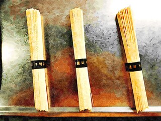 Three packets of raw noodles on the kitchen counter ready to be cooked.