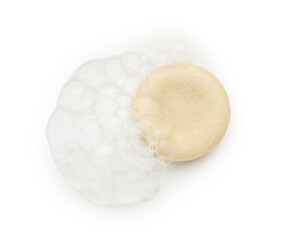 Soap with foam on white background, top view