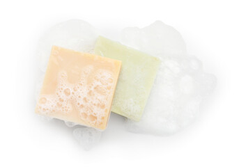 Soap bars with foam on white background, top view