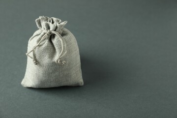 Burlap sack on gray background. Space for text