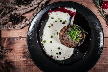 Gourmet Beef Medallion with Creamy Sauce, Top View - Fine dining meat dish presentation for restaurant menu design