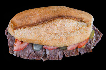 Meat doner between bread on a black background. Traditional Turkish cuisine doner. Meat Doner...