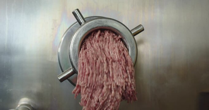 Industrial meat processing machine in a factory. Meat processing plant concept.