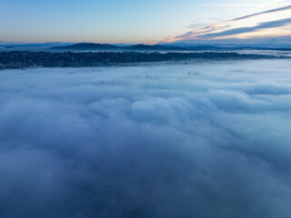Early morning light illuminates a layer of fog covering the Willamette River and much of the valley it runs through in Oregon. The Pacific Northwest receives plenty of fog throughout the year.