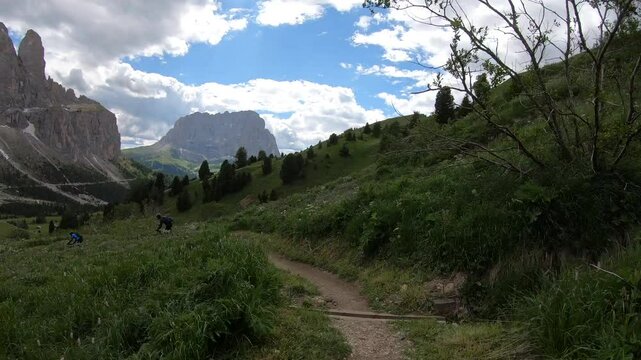 Mountain biker descending the S1 All Fever Trail from Passo Pordoi to Arabba, Sellaronda MTB, Dolomites