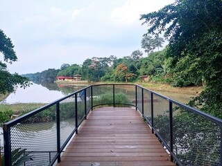 Naklejka premium wooden bridge over the river
