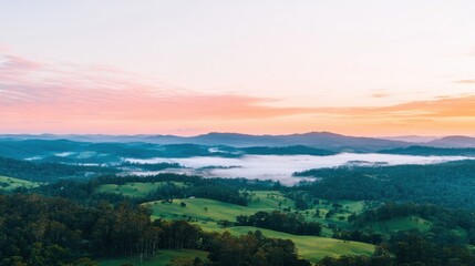 Fototapeta premium Breathtaking sunrise over lush green valleys scenic landscape serene environment aerial view nature's beauty