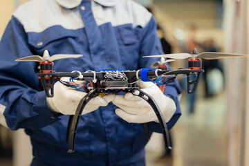 Industry worker pilot hold modern drone for mining industrial site © Parilov