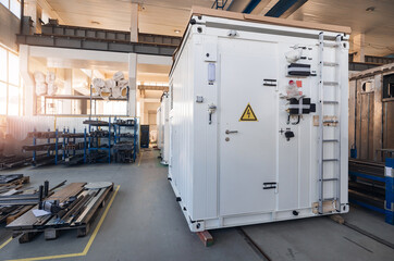 Industrial factory interior with equipment and storage units