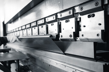 Industrial sheet metal bending machine in operation