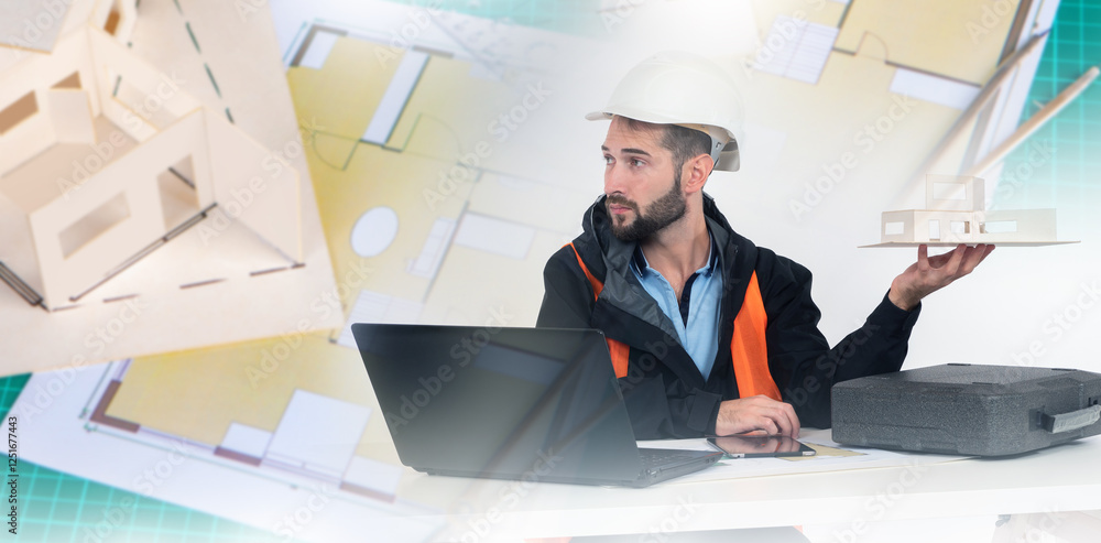 Poster man foreman construction team. architect sits at table with laptop. engineering models and drawings 