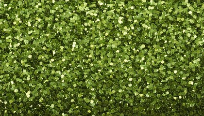 Shimmering green glitter scattered on a flat surface for arts and crafts